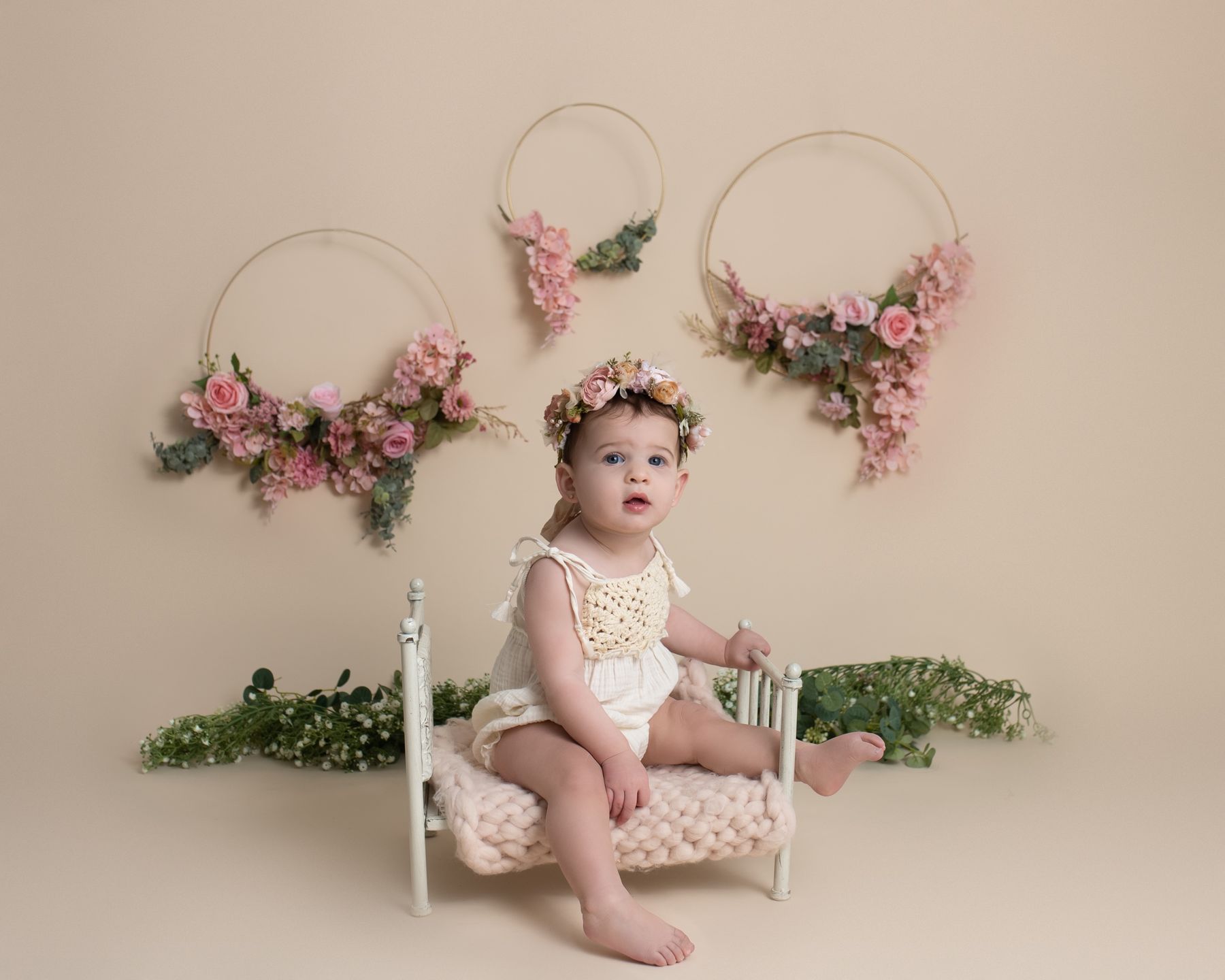 Six-month portrait with flower hoops